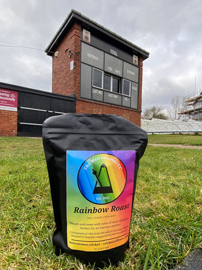 Rainbow Roast coffee from The Metronomes CC by Clubhouse Roastery, featuring colorful rainbow packaging and fresh coffee beans.