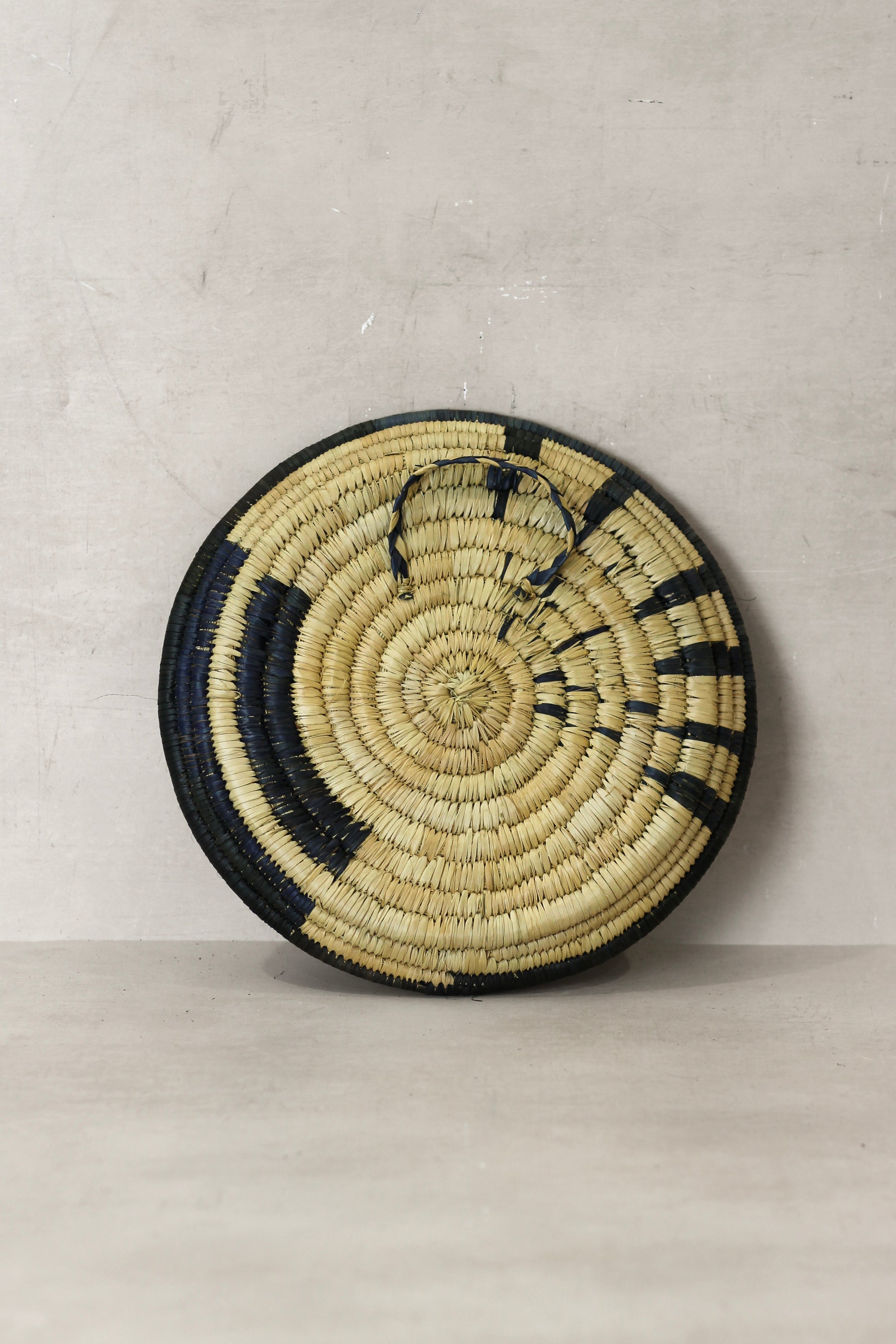 Small Malawi Wall Basket No 11 by Botanical Boys, decorative wall art with woven design, suitable for home decor or artistic display.