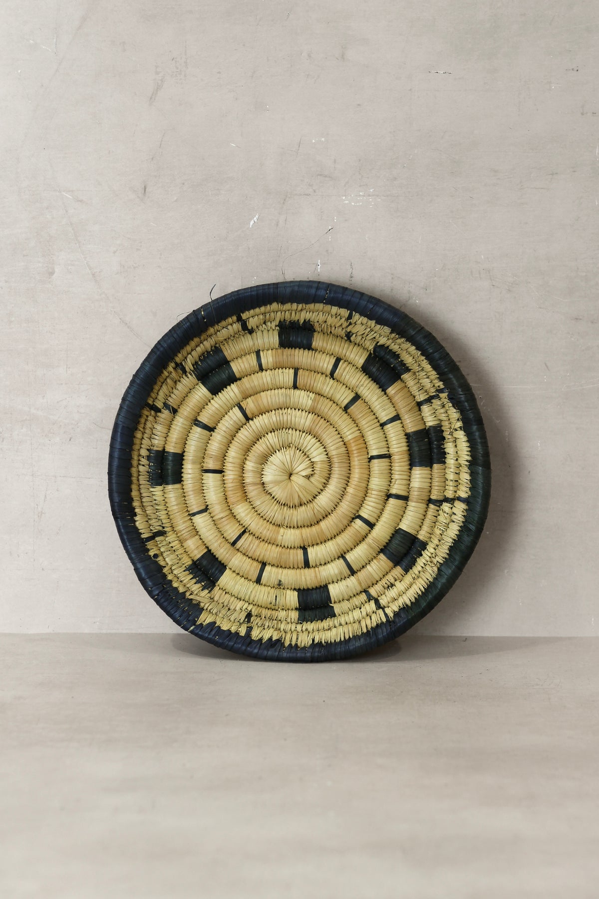 Small Malawi Wall Basket No 12 by Botanical Boys, decorative wall art with woven design suitable for interior decor.