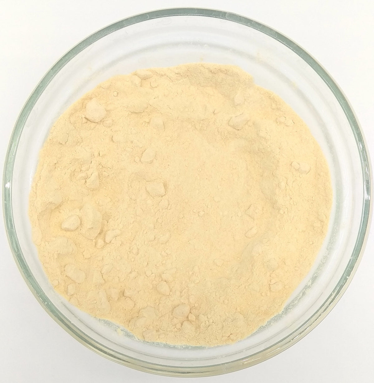 Organic carrot powder from Whole Food Earth, close-up of vibrant orange powdered herb on a white background.
