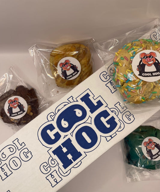 Assorted cookies in a "Pick Your Own" box from Cool Hog Snacks, featuring a variety of freshly baked cookie types.