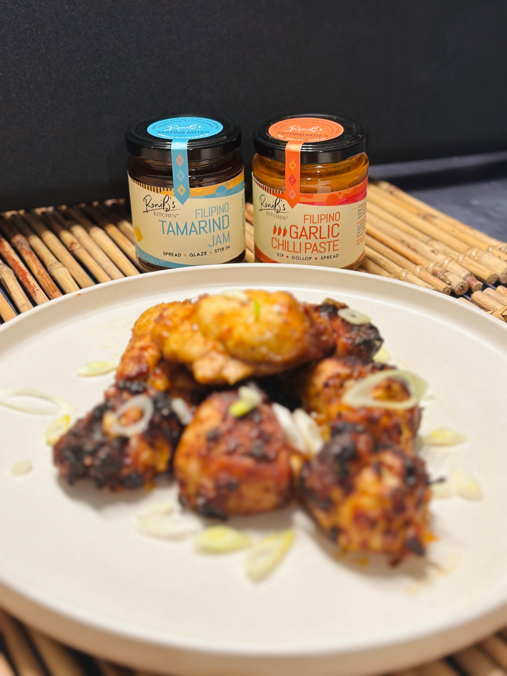 RoniBs Kitchen Filipino garlic chilli paste hot sauce with Scotch Bonnets, medium heat, vegan, showing a jar of spicy sauce.