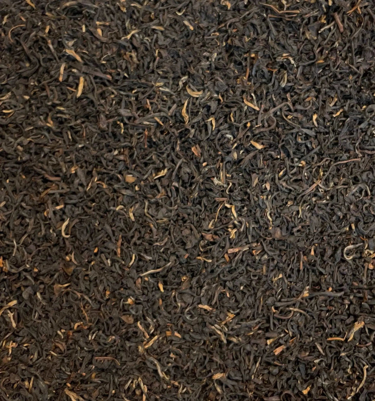Assam Mangalam FTGFOP1 tea leaves from High Teas, showcasing fresh, whole dried tea leaves in a close-up shot.
