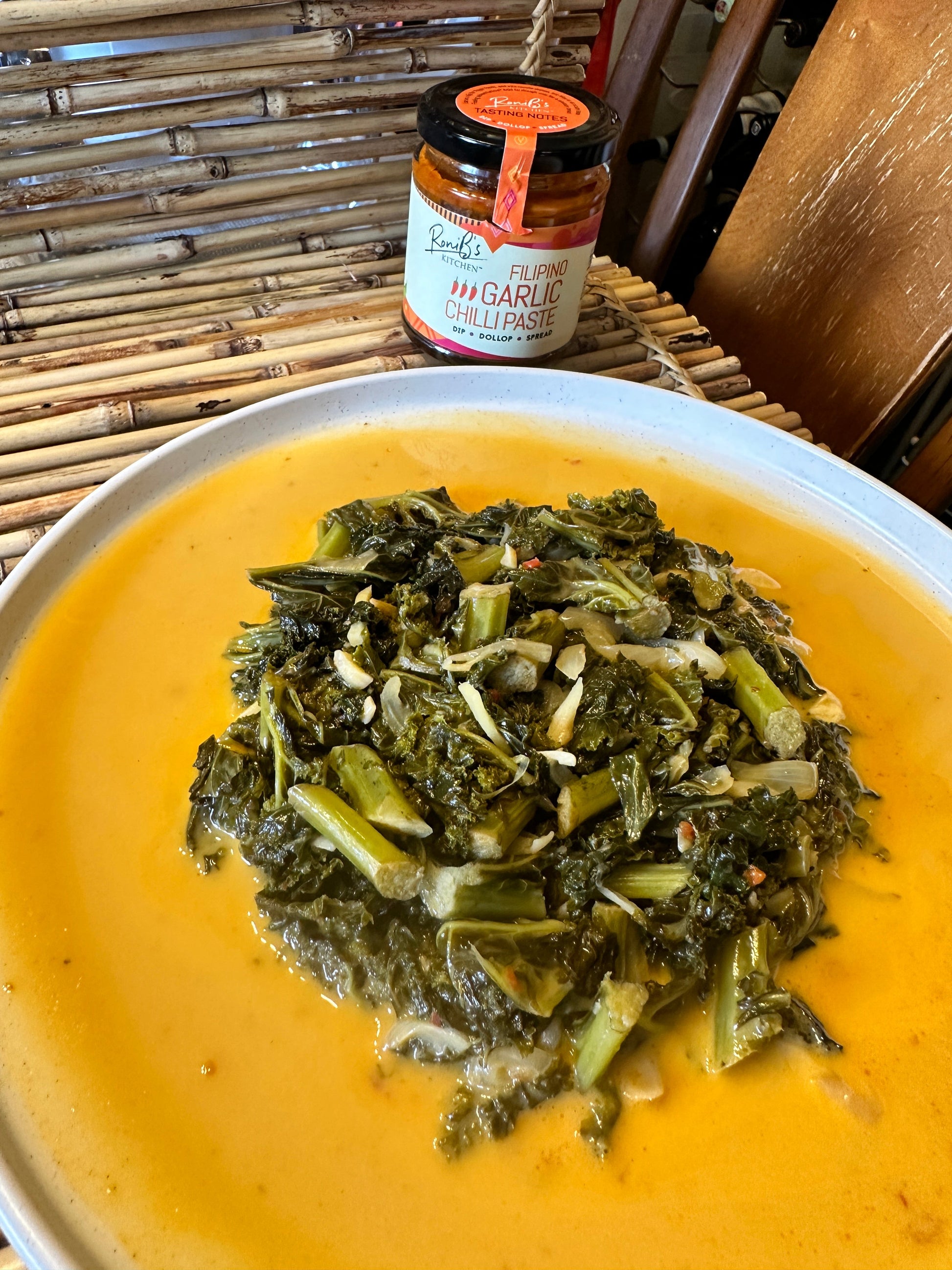 Filipino garlic chili paste with Scotch Bonnets from RoniBs Kitchen, medium heat hot sauce, vegan-friendly, in a glass jar.