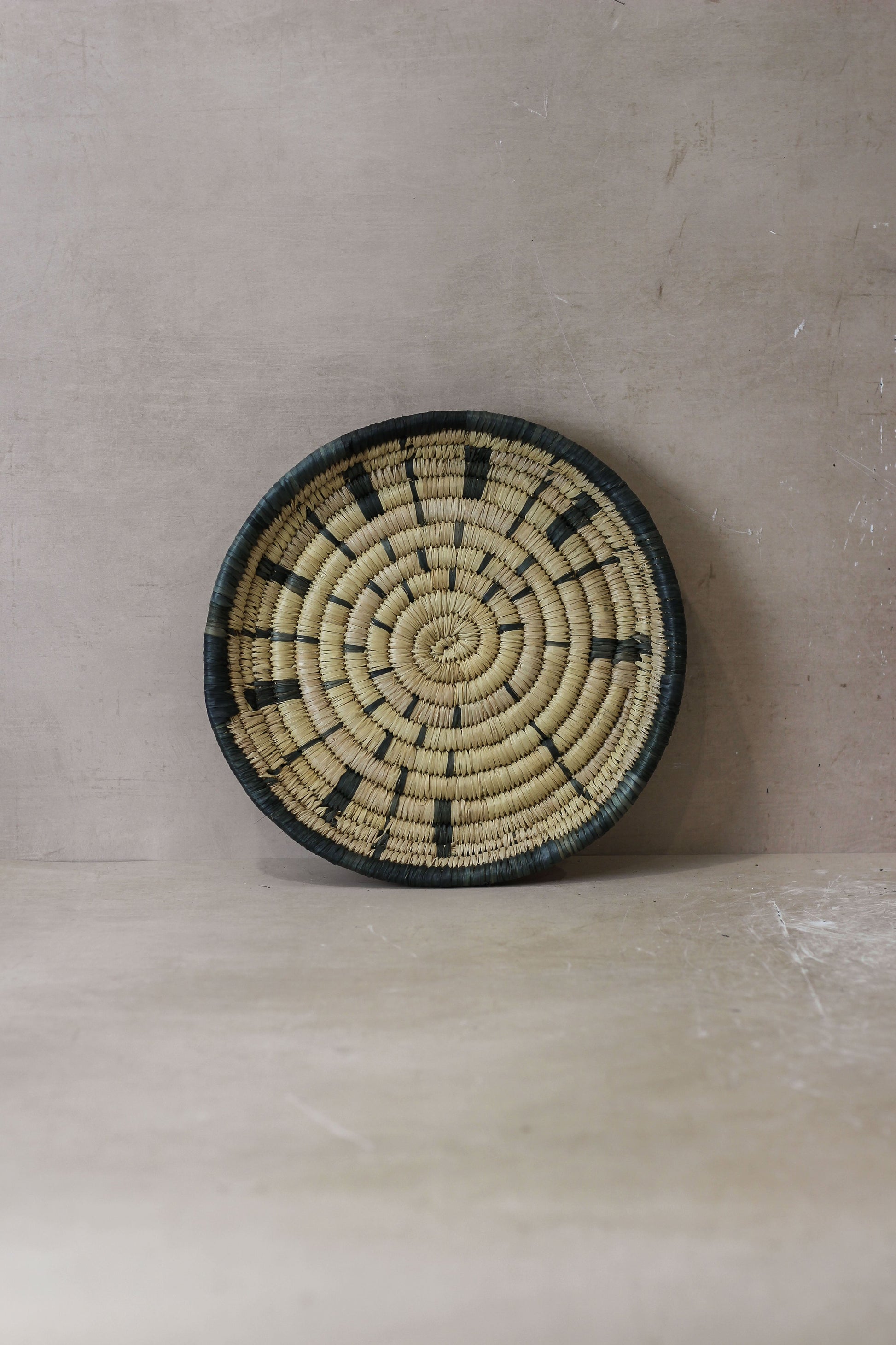 Small Malawi Wall Basket No 3 by Botanical Boys, woven wall art with natural fibers, showcasing intricate craftsmanship and texture.
