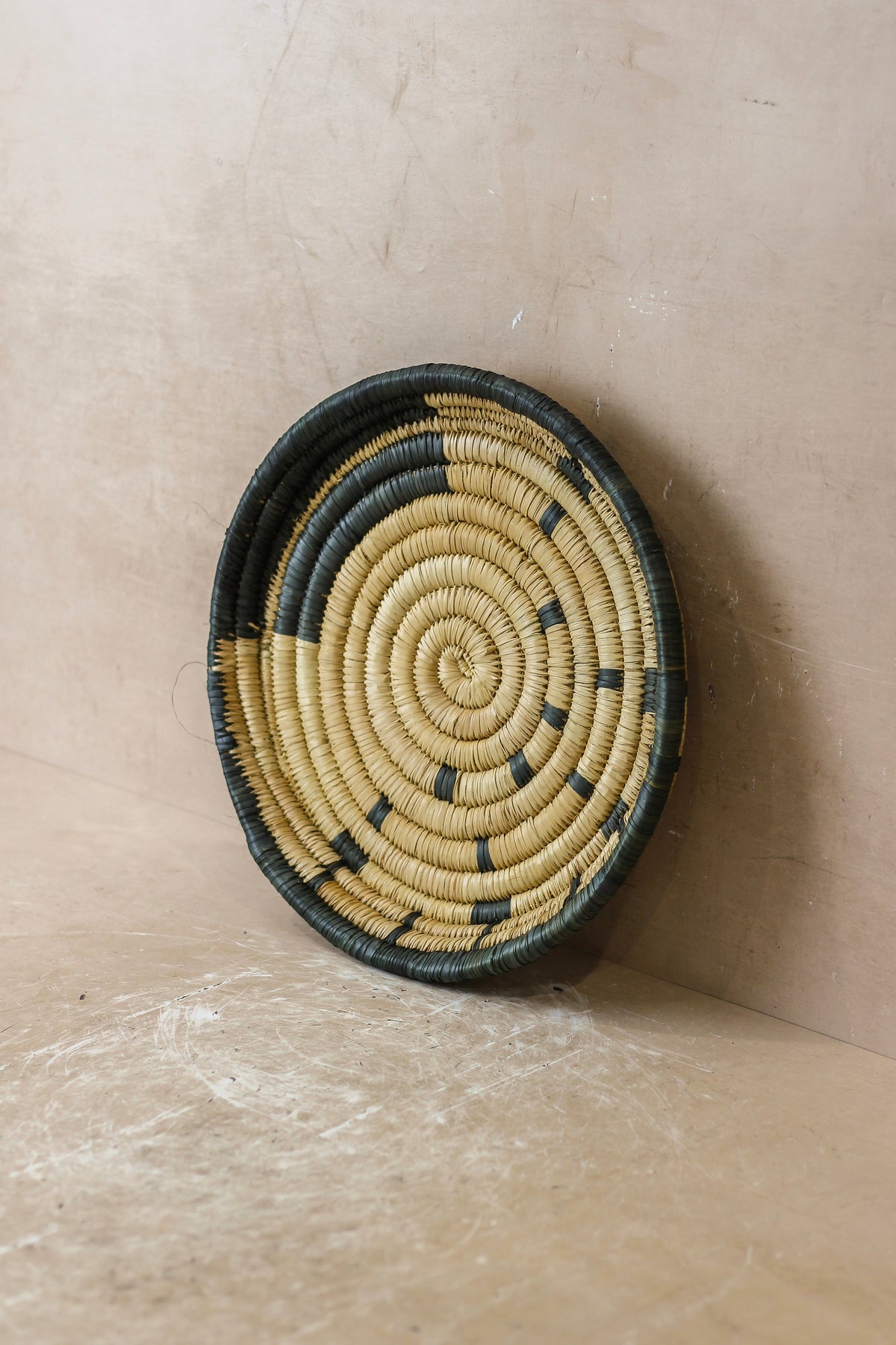 Small Malawi Wall Basket No 5 by Botanical Boys, decorative wall art with woven natural fibers and intricate design.