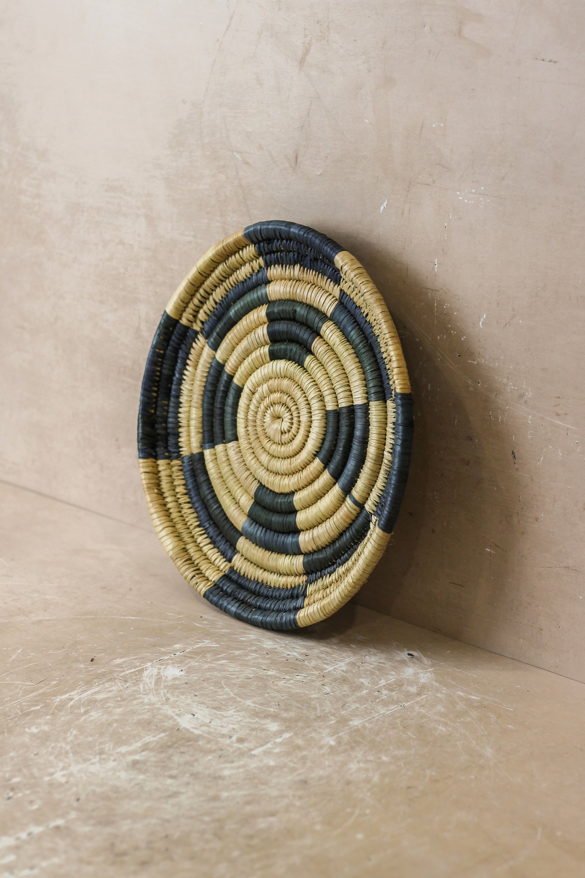 Small Malawi Wall Basket No 6 by Botanical Boys, a handcrafted woven wall art piece with natural fibers and intricate design.