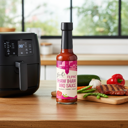 Filipino Ihaw Ihaw BBQ sauce by RoniBs Kitchen in a bottle, with air fryer in a kitchen setting, ideal for marinades and grilling.
