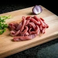 Primrose Herd pork tenderloin stir fry strips shown in a close-up image, highlighting tender, sliced pork for stir-fry dishes.