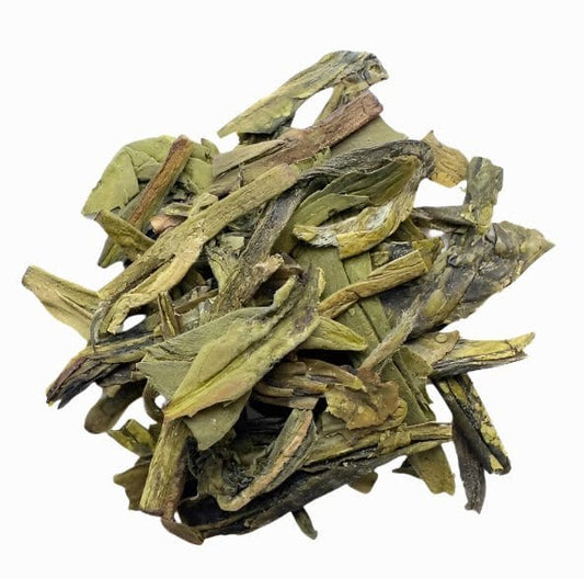 Organic Dragonwell green tea from Porter Hill Tea Company, showing fresh green tea leaves in a traditional brewing setting.