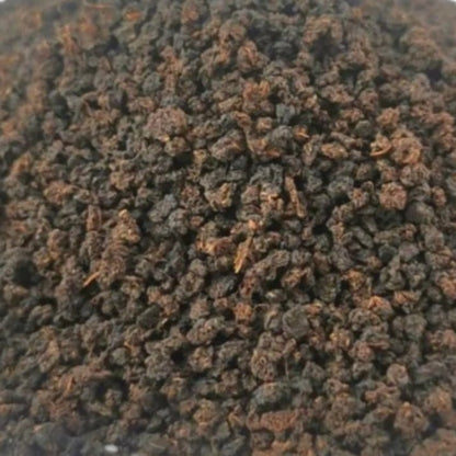 Loose leaf Irish Breakfast black tea from Porter Hill Tea Company, showing dark, full leaves in a clear glass jar.