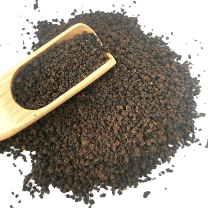 Loose leaf Irish Breakfast black tea from Porter Hill Tea Company, showing dark, fragrant tea leaves in a natural setting.