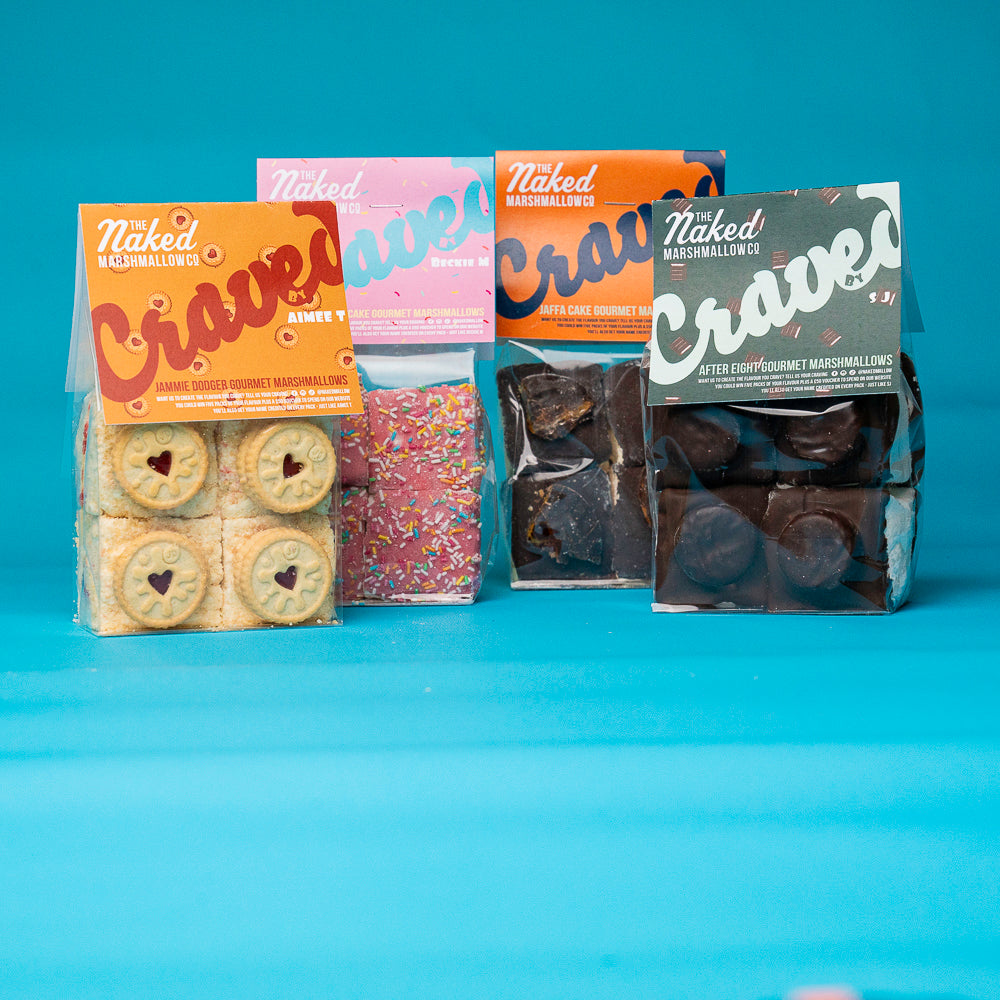 Assorted Craved Edition gourmet marshmallows from THE MARSHMALLOW FACTORY, featuring colorful, fluffy marshmallow treats on a white background.