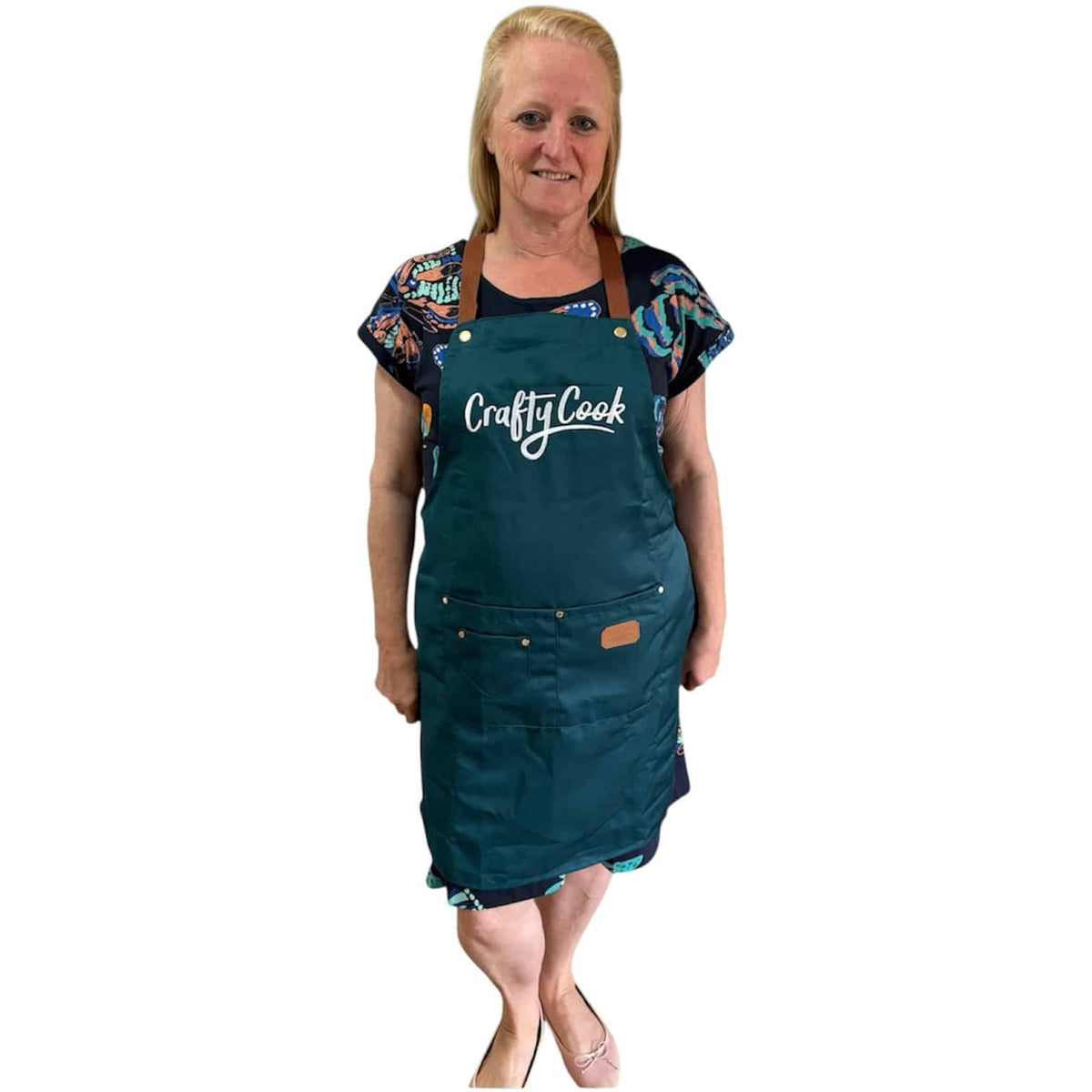 Teal Crafty Cook apron with multiple pockets, designed for cooking and baking, featuring a comfortable fit and durable fabric.