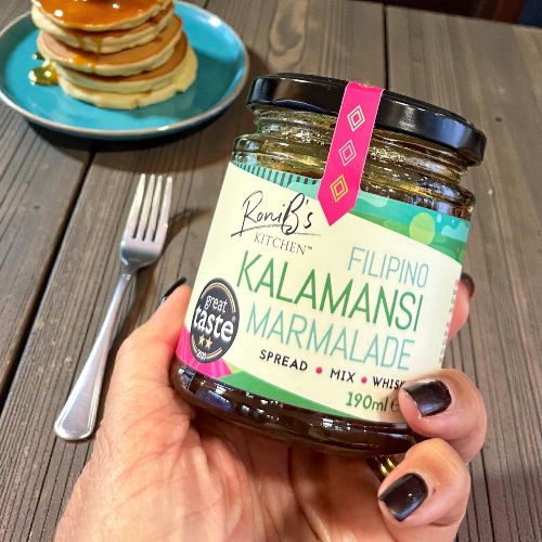Filipino Kalamansi marmalade with Don Papa Rum served on pancakes, showcasing vibrant citrus jam from RoniBs Kitchen.