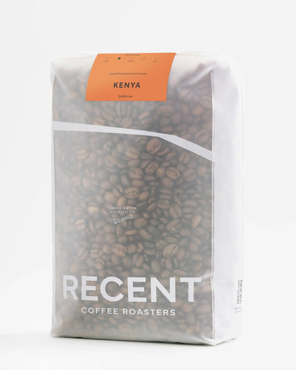 Kenya Sasini AA Medium Roast Coffee beans in 1kg bag from Recent Beans, showing glossy coffee beans ready for brewing.