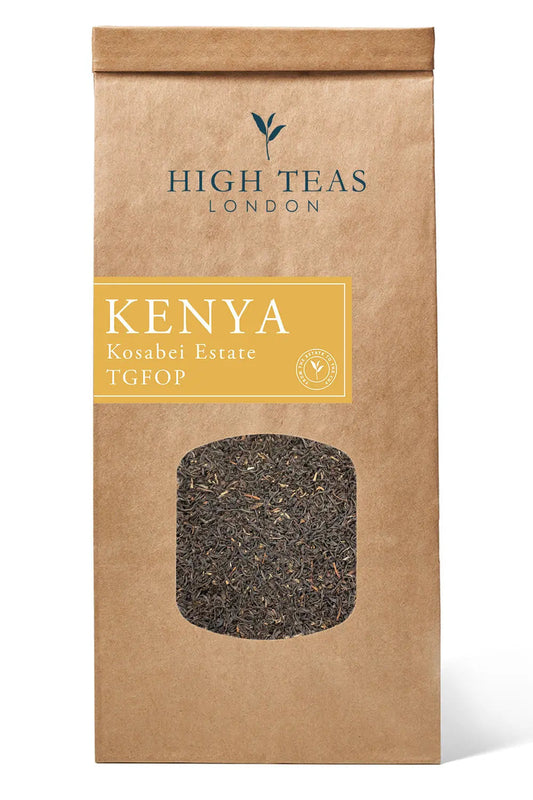 Loose leaf Kenya Kosabei Estate TGFOP tea from High Teas, showing bright, golden tea leaves in a clear glass jar.