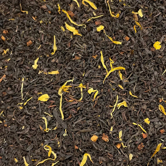 Loose leaf Lady Londonderry Afternoon Tea House Blend by High Teas in a decorative tin with tea leaves and a teacup.