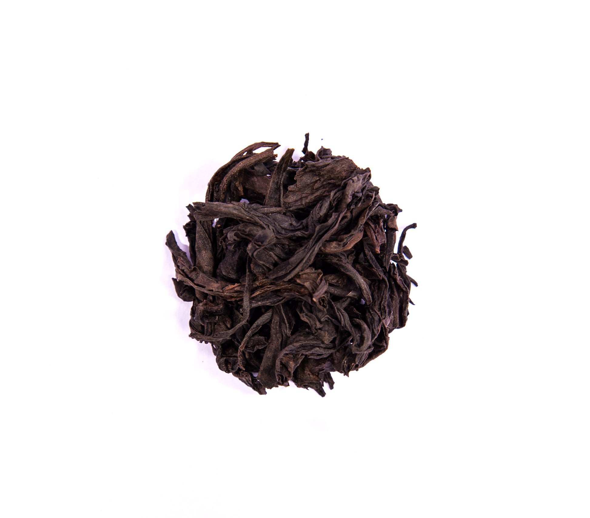 Limited edition Zhou Family handmade Wuyi Da Hong Pao tea leaves from PekoeTea Edinburgh, showcasing dark, roasted tea leaves.
