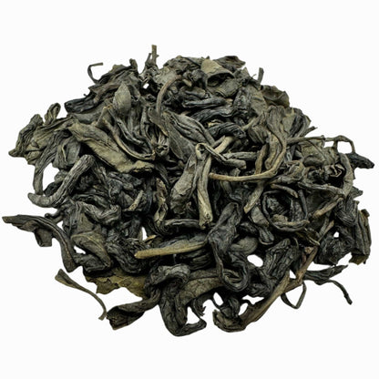 Loose leaf Lucky Dragon Hyson green tea from Porter Hill Tea Company, showing vibrant green tea leaves in a clear container.
