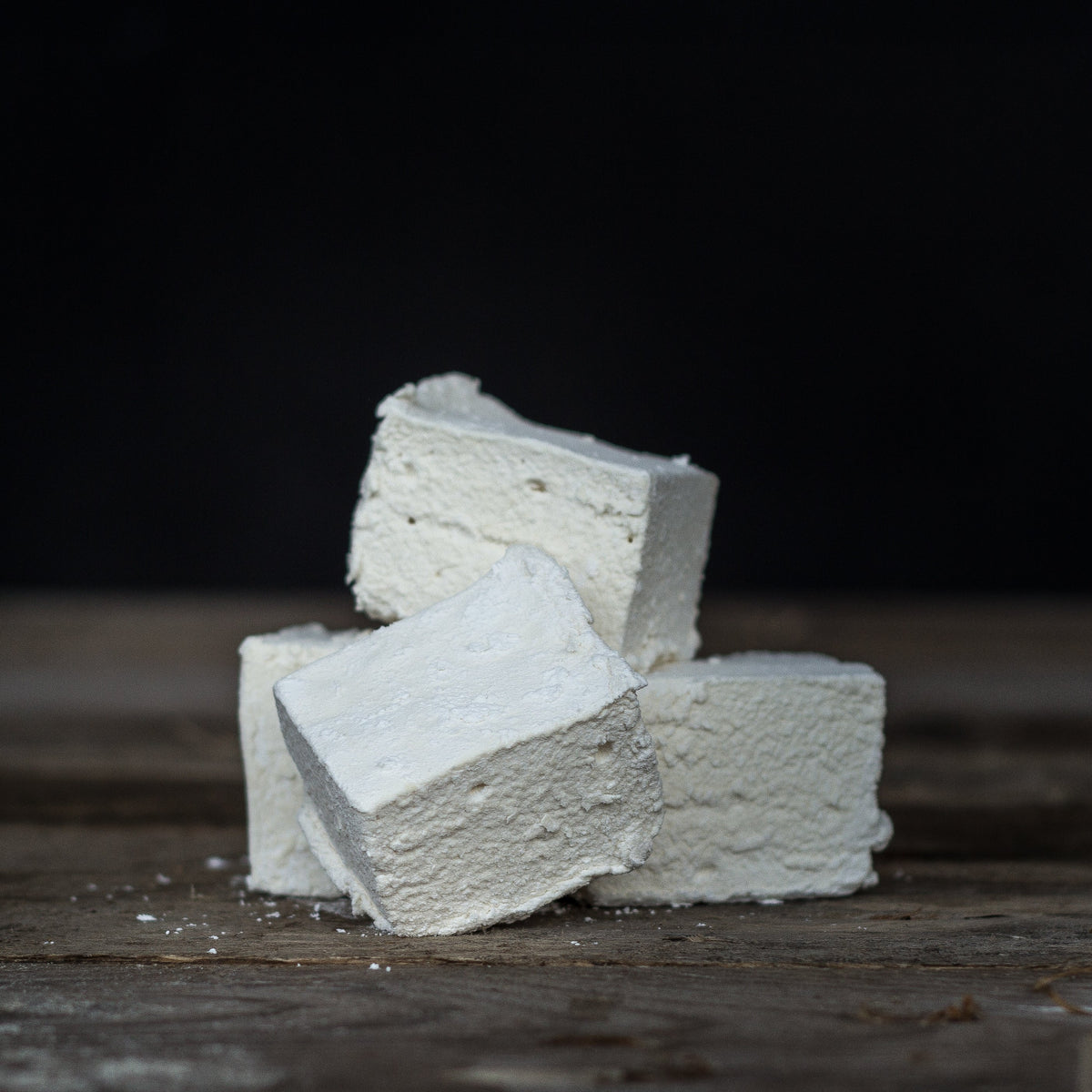 Harry's Hot Chocolate giant marshmallows on a plate, soft and fluffy with a white, pillowy appearance, perfect for hot chocolate.