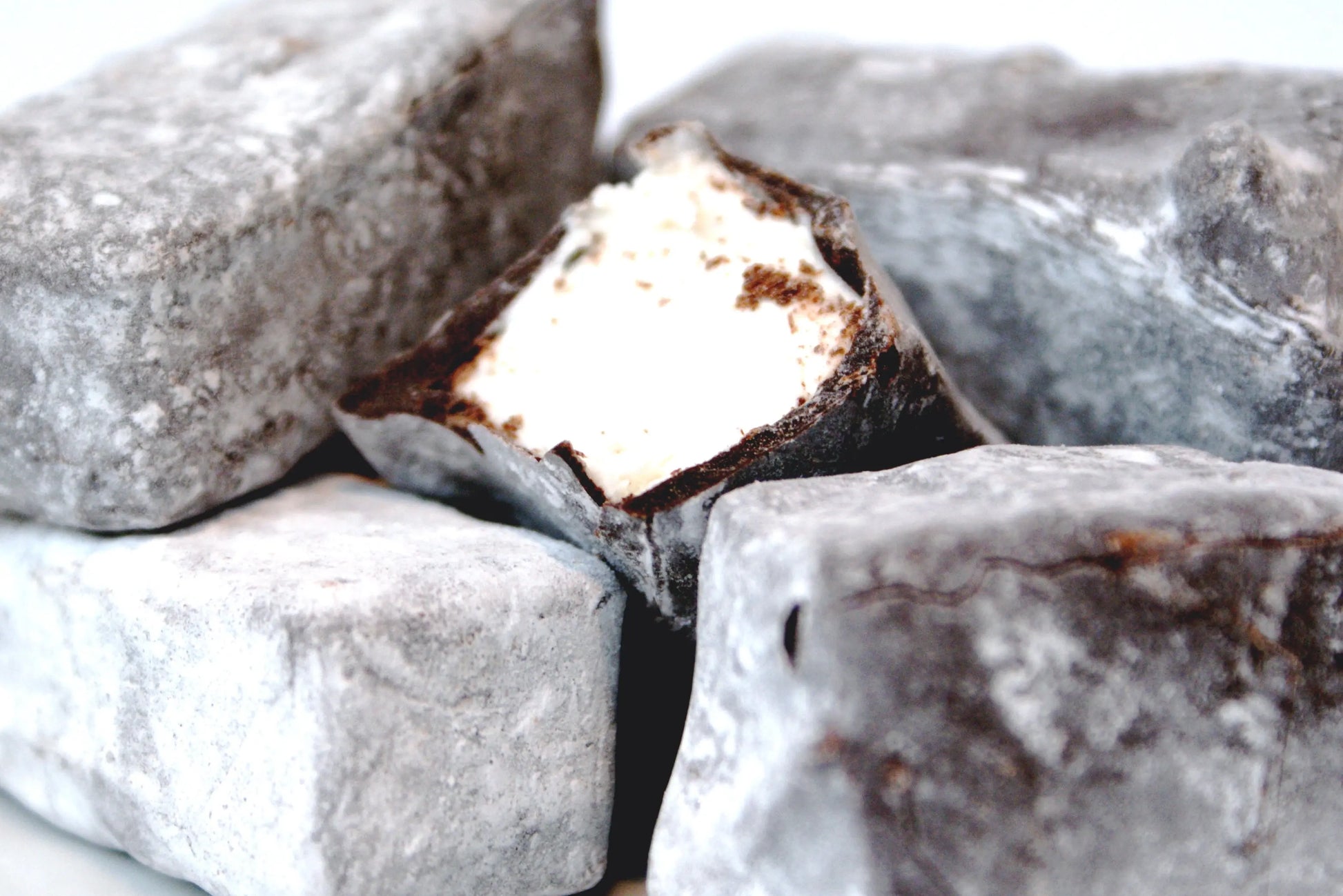 Gorvett & Stone honey and vanilla marshmallow dipped in dark chocolate, showcasing a soft marshmallow treat with rich chocolate coating.