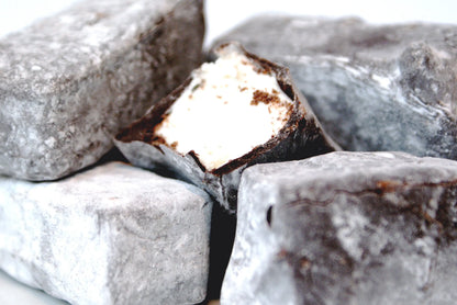 Gorvett & Stone honey and vanilla marshmallow dipped in dark chocolate, showcasing a soft marshmallow treat with rich chocolate coating.
