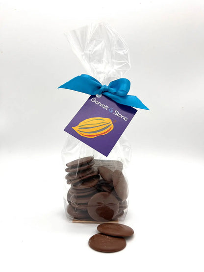 Milk chocolate couverture buttons from Gorvett & Stone, round smooth chocolate melting buttons for baking and confectionery.
