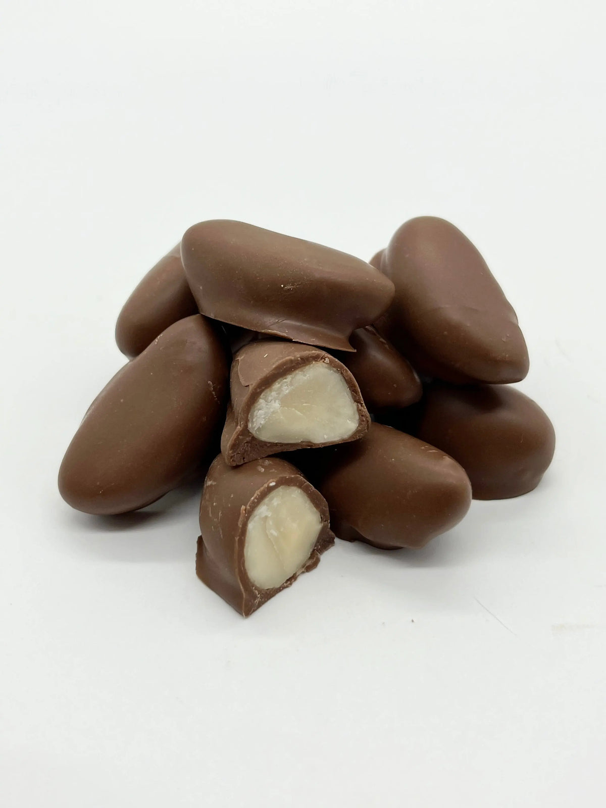 Milk chocolate-covered Brazil nuts from Gorvett & Stone, showcasing shiny, smooth chocolate coating on whole nuts.