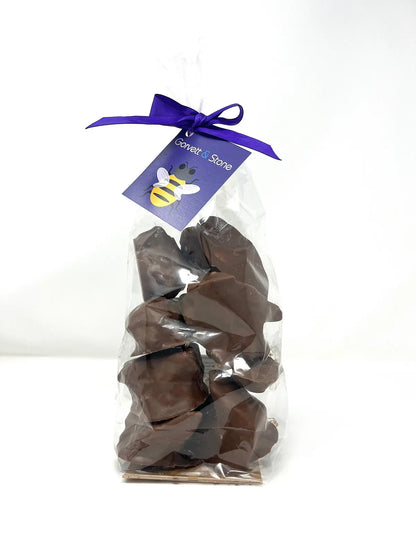 Handmade milk chocolate cinder toffee and honeycomb pack by Gorvett & Stone, showing golden toffee pieces in a clear package.