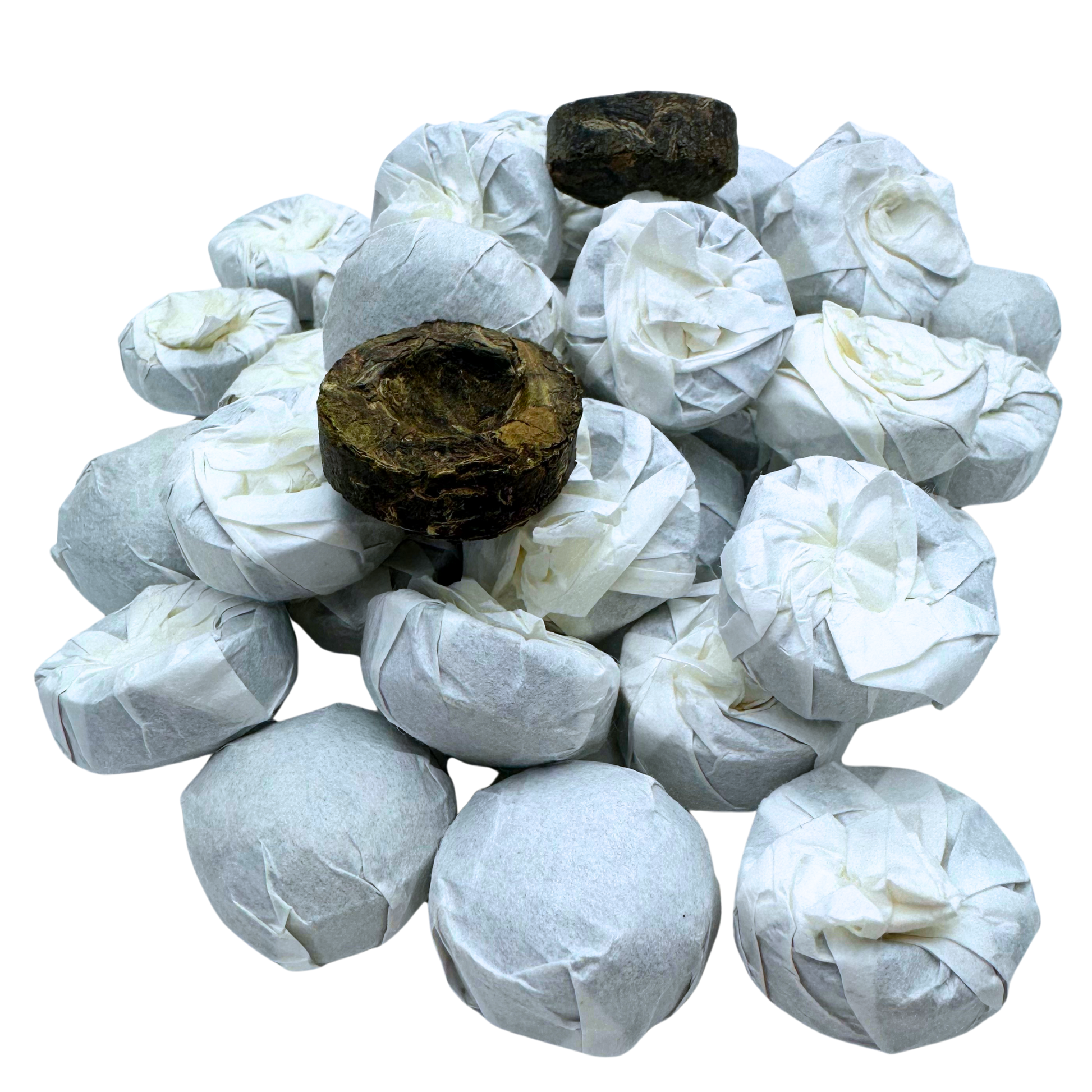 Mini Pu-erh Toucha tea from Porter Hill Tea Company, showing small black tea tea cake with dark, compressed leaves.