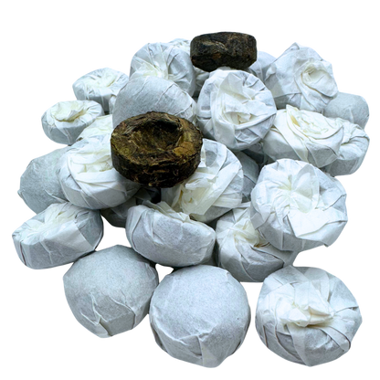 Mini Pu-erh Toucha tea from Porter Hill Tea Company, showing small black tea tea cake with dark, compressed leaves.