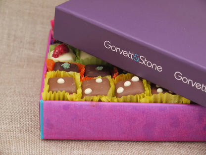 Open Gorvett & Stone chocolate gift box featuring a variety of assorted chocolates in a mixed selection box.