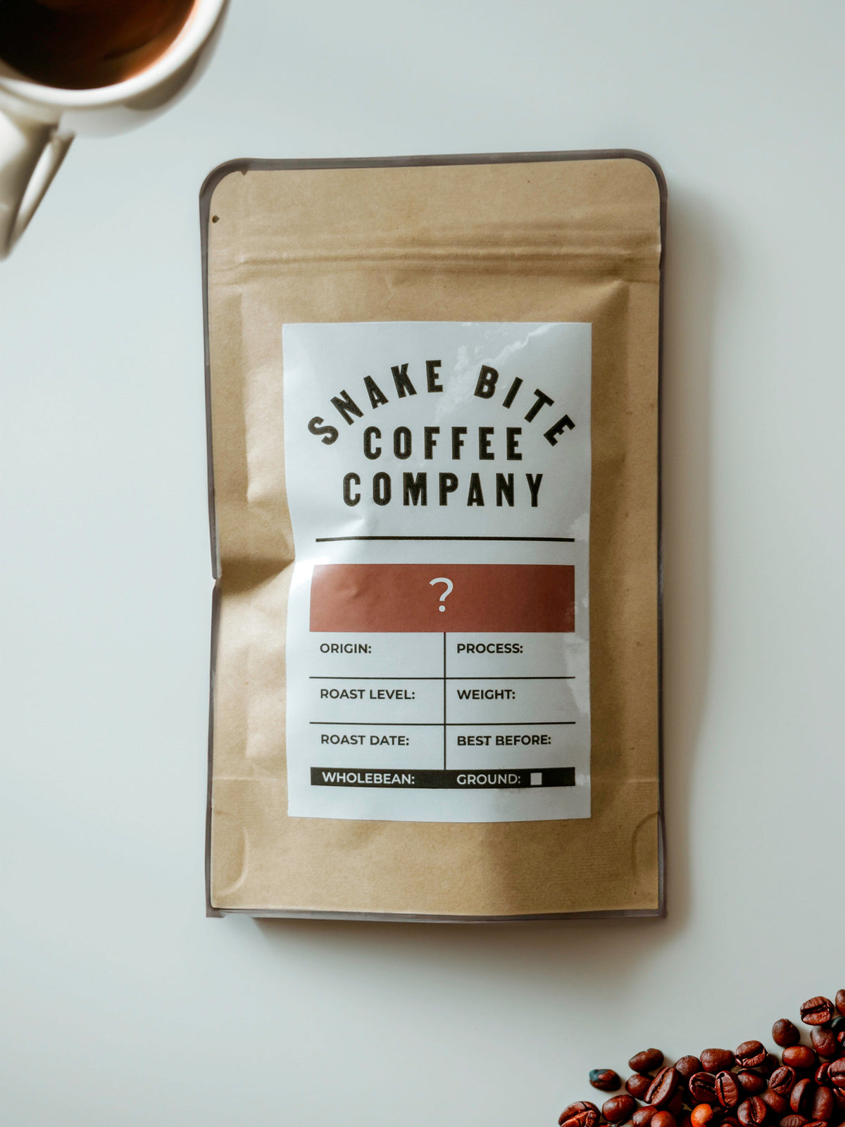 A 50g bag of Snake Bite Coffee's Explorers Delight Mystery Coffee, with a colorful, adventurous-themed coffee packaging.