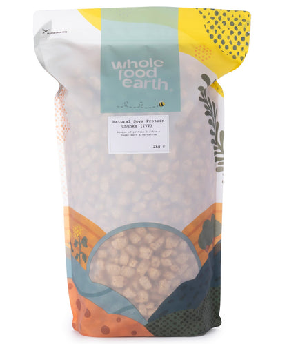 Two kilograms of Whole Food Earth TVP natural soya protein chunks in a clear plastic bag, showing the textured soy product.