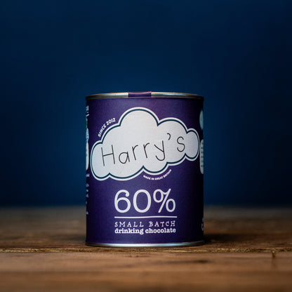 A square image of Harry's Hot Chocolate 60% hot chocolate powder in a packaging bag, ready for making rich hot chocolate.