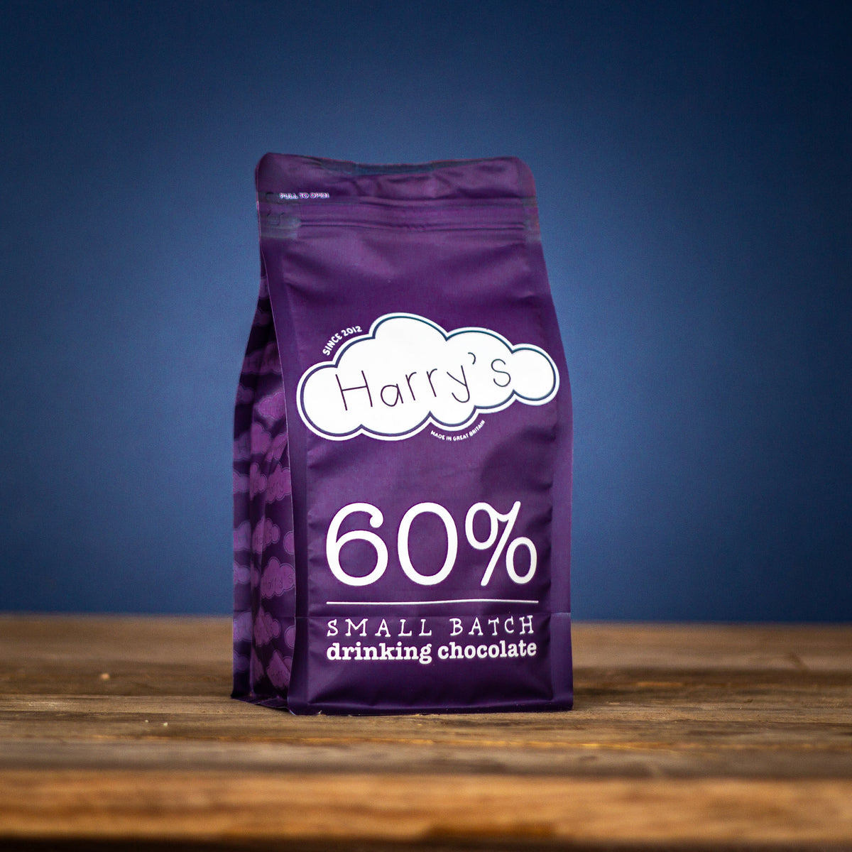 Bag of Harry's Hot Chocolate 60% hot chocolate powder in a 1kg package, showing rich cocoa content and smooth texture.