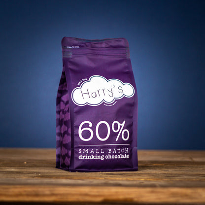 Bag of Harry's Hot Chocolate 60% hot chocolate powder in a 1kg package, showing rich cocoa content and smooth texture.