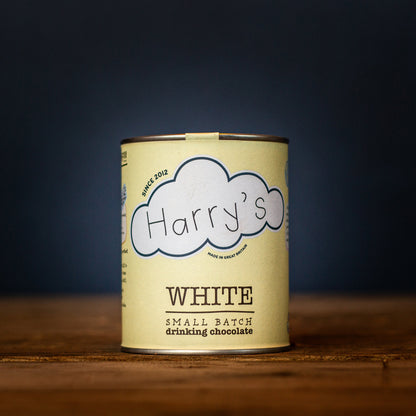 White 30% hot chocolate powder by Harry's Hot Chocolate, shown in a square container with a smooth white surface.