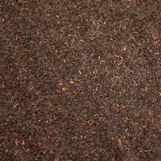 Loose leaf Honest Everyday Nilgiri BOP tea from High Teas, showing dark, twisted tea leaves in a close-up image.