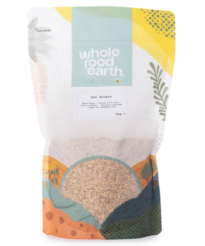Whole Food Earth oat groats in a 1kg bag, showing the raw, whole oat grains suitable for cooking or baking.