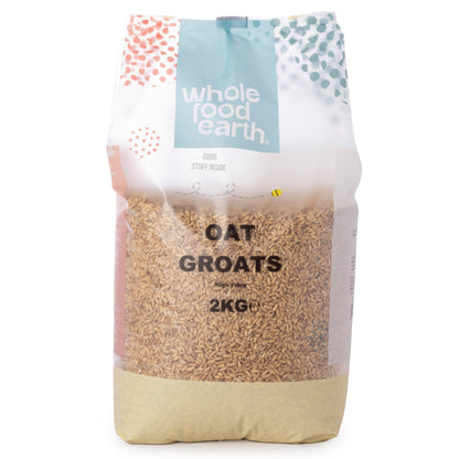 Whole Food Earth oat groats in a 2kg bag, showing plump, whole oat grains ideal for healthy cooking and baking.