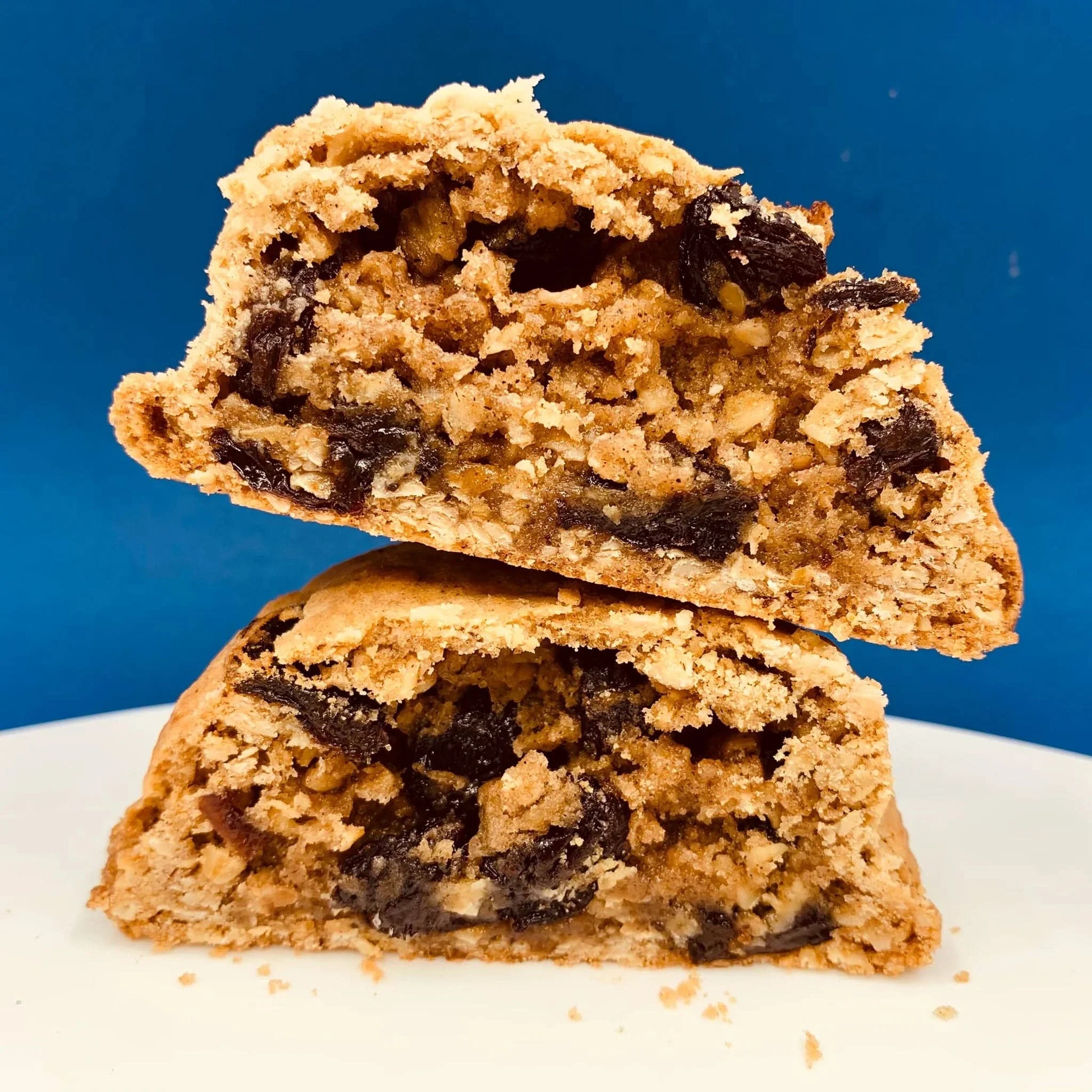 Oat and raisin cookie from Cool Hog Snacks showing a golden-brown oat and raisin treat on a white background.