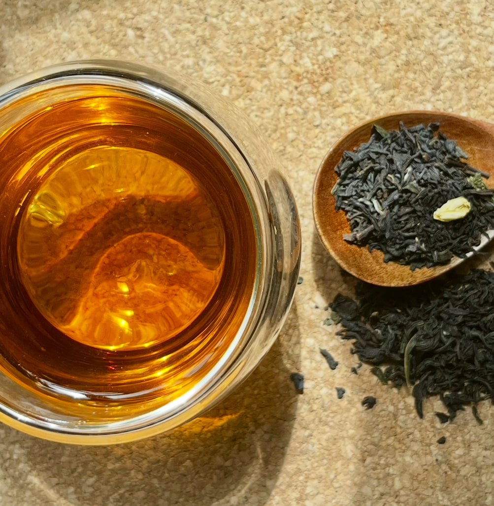 Loose leaf Orange Jasmine Oolong tea by Porter Hill Tea Company, featuring vibrant orange jasmine-flavored oolong leaves.