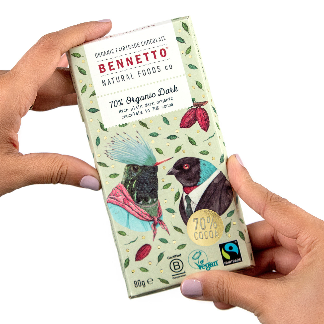 Bennetto Natural Foods UK organic dark chocolate bar, 70% cocoa, with hands holding the chocolate piece.