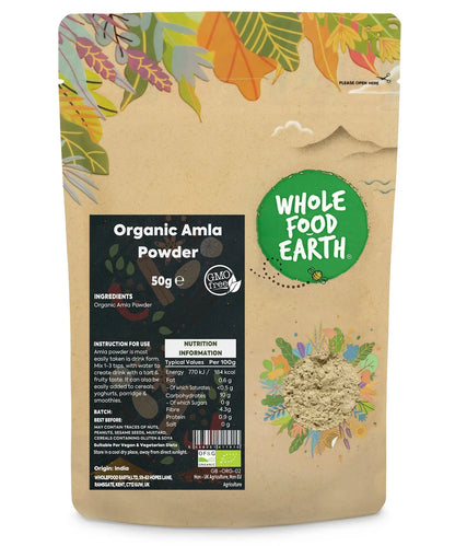 Organic Amla powder from Whole Food Earth, 50g, in a clear jar, showcasing the vibrant green herbal spice used for health and wellness.