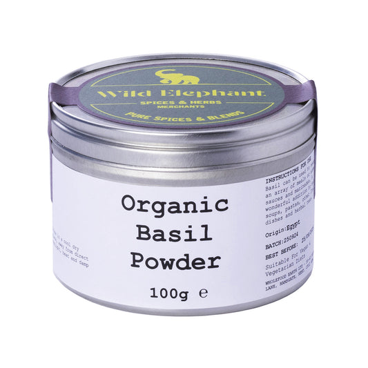 Organic basil powder by Whole Food Earth, 100g, in a clear jar, showcasing fresh green organic basil herb for culinary use.