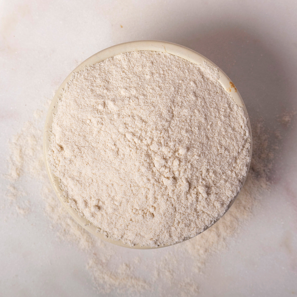 Organic brown rice flour from Whole Food Earth, showcasing a bag of gluten-free, natural brown rice flour on a kitchen countertop.