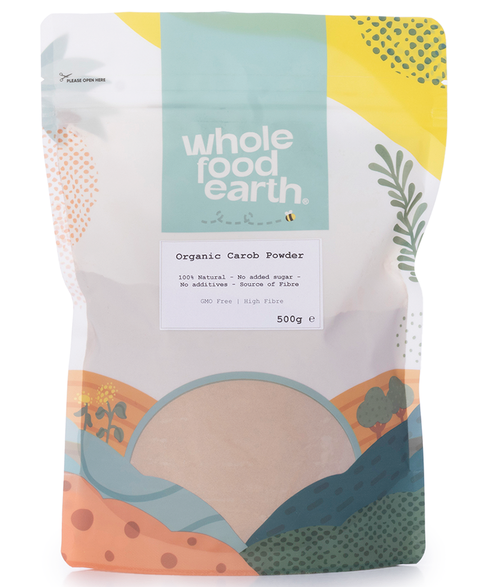 Organic carob powder in a 500g package from Whole Food Earth, showcasing a close-up of the brown, fine powder in a container.