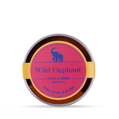 Organic cayenne pepper powder from Wild Elephant, 100g, in a clear jar showing bright red spice, from Whole Food Earth Herbs & Spices collection.